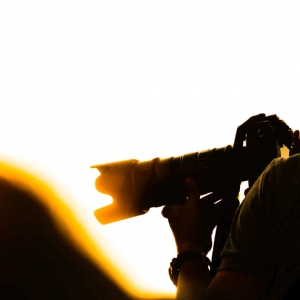 Photographers are shooting at sunset.